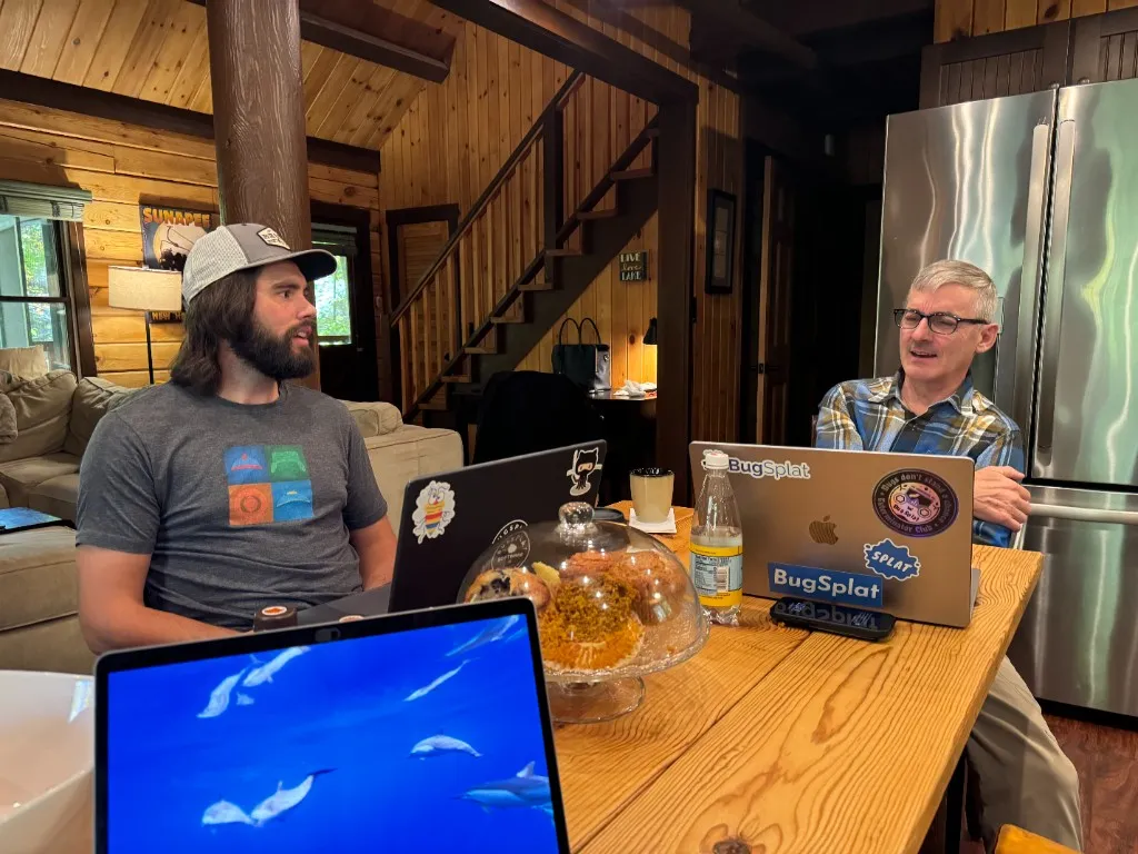 BugSplat team members working together at a cabin retreat